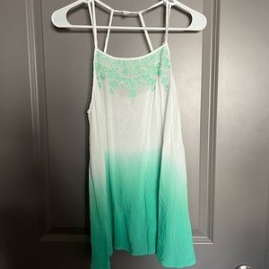 Light linen top with details on neck line, strappy detail in the back